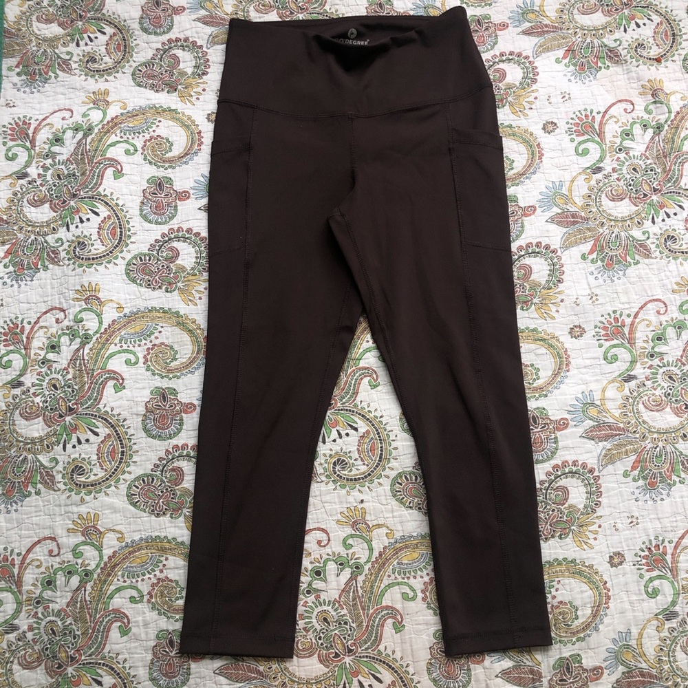 Dark purple high-waisted athletic leggings with pockets